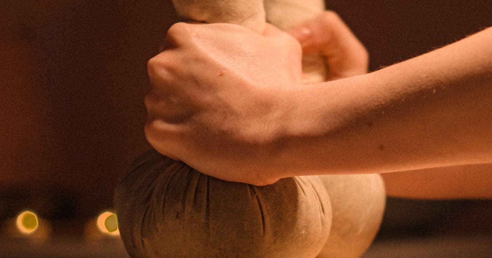 Herbal compress massage during a treatment — what panchakarma actually looks like
