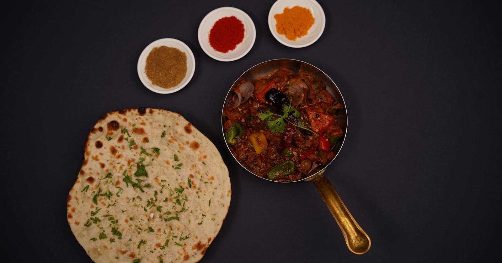 Top view of lachha bread, spices and curry — Ayurveda's rules for which foods belong together