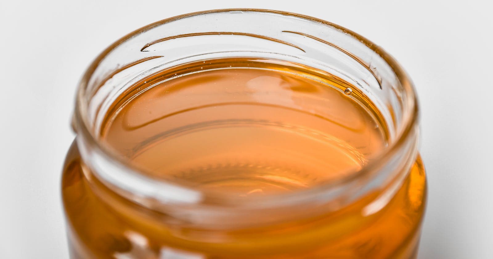 Jar of golden liquid — ghee, the fat Ayurveda has loved for three thousand years