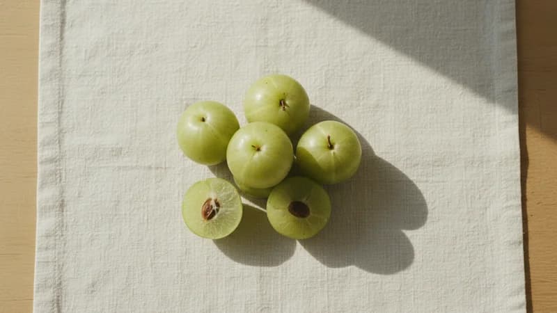 Amla (Indian Gooseberry) (Amalaki) — whole and prepared form, top-down still life