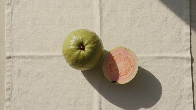 Guava (Amruta) — whole and prepared form, top-down still life